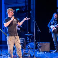 Two musicians performing on stage