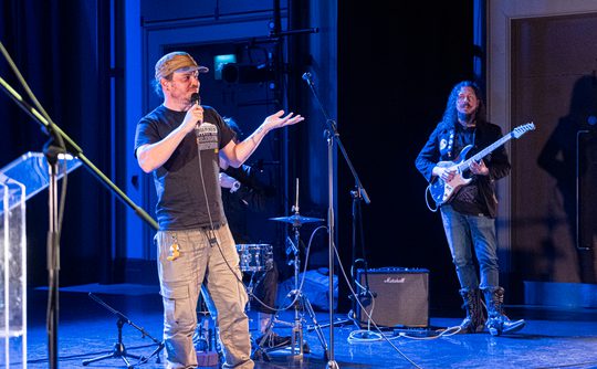 Two musicians performing on stage