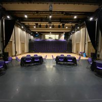 A group of tables on a large stage