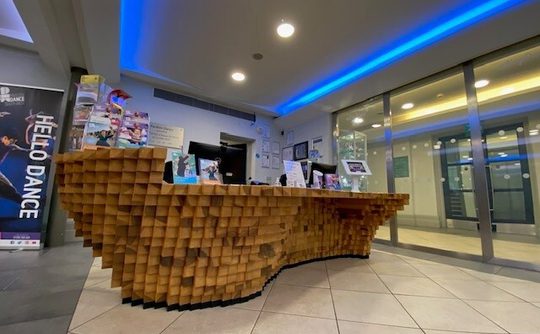 The reception desk made of blocks of wood