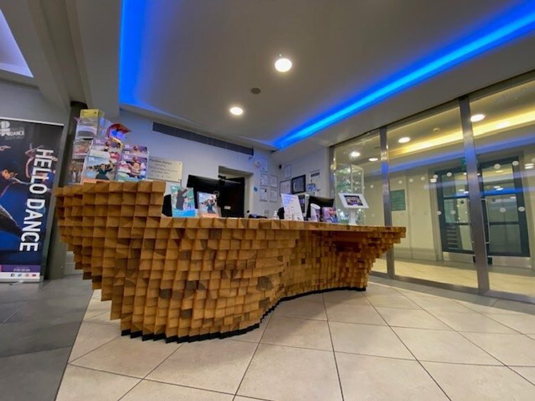 The reception desk made of blocks of wood