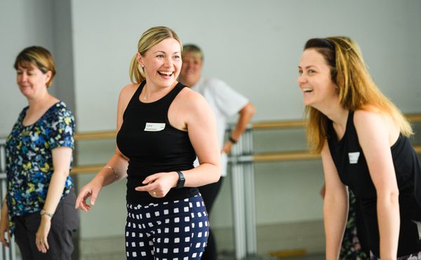 4 people laughing in a dance class